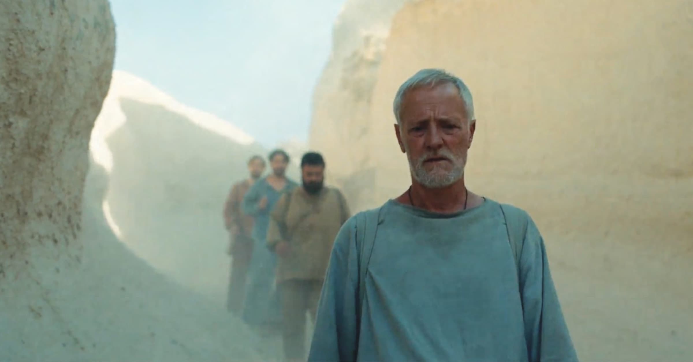 Vid, the teacher, walks toward the sanctuary